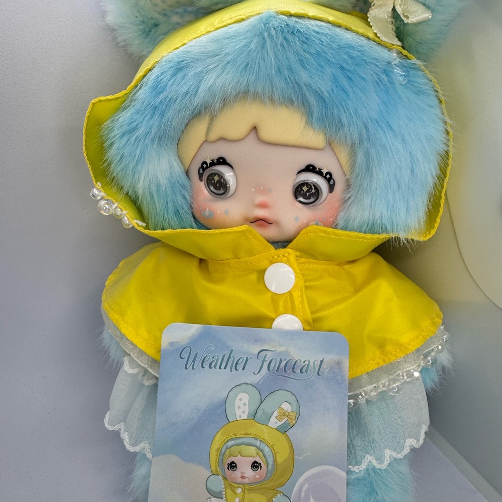 Nommi Weather Forecast Drizzle Charming Blue and Yellow Plush Doll with Hood